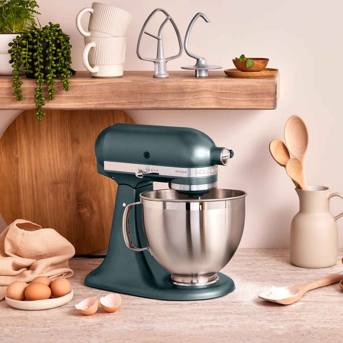 KitchenAid KSM195 Artisan Mixer Juniper – on counter with attachments displayed