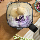 Top-down view of the KitchenAid Pure Power Blender jar filled with ice cream, milk, and berries, ready for blending.