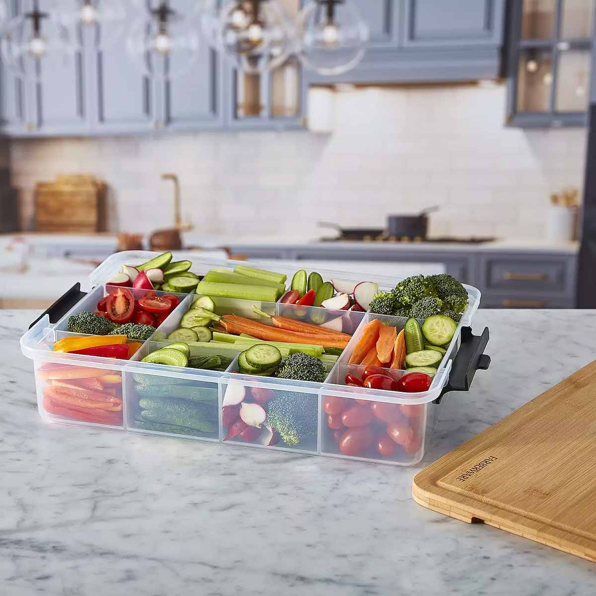 Farberware SnackleBox with Bamboo Board 30 x 40cm - filled with fresh vegetables on a kitchen counter.
