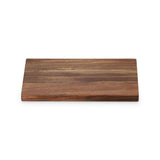 Le Creuset Acacia Chopping Board 40cm with natural wood grain and rounded edges.
