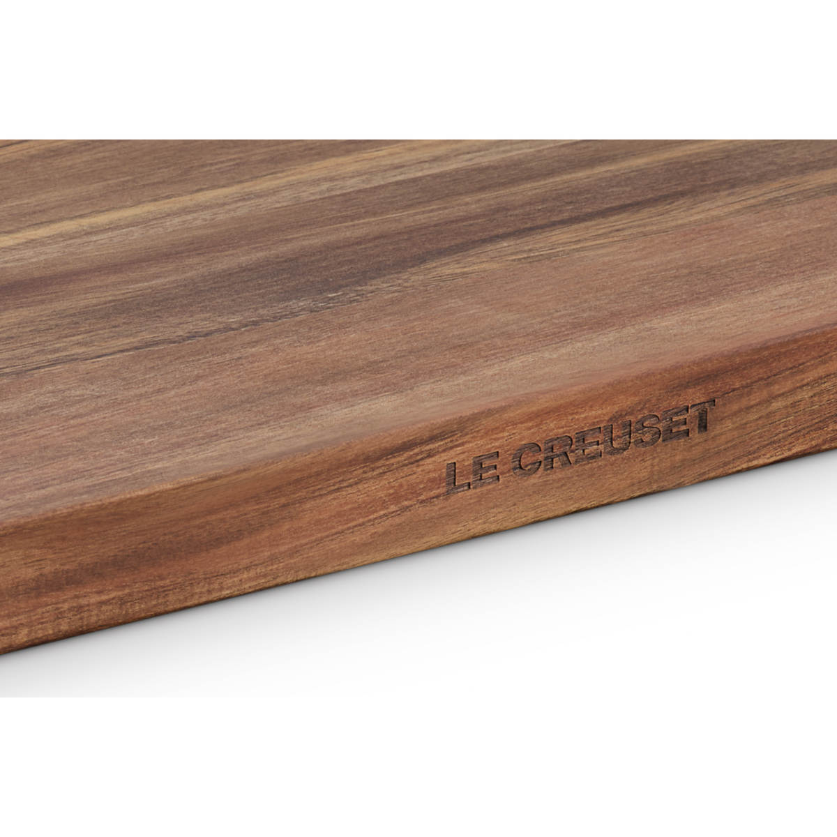 Le Creuset Acacia Chopping Board 40cm with natural wood grain and rounded edges.
