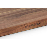 Le Creuset Acacia Chopping Board 40cm with natural wood grain and rounded edges.