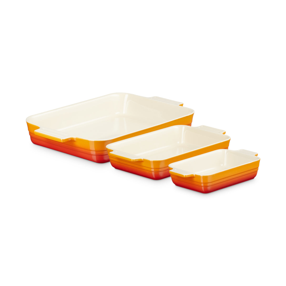 Top view of Le Creuset Rectangular Dish Volcanic Set of 3 in orange gradient on white background