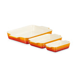 Top view of Le Creuset Rectangular Dish Volcanic Set of 3 in orange gradient on white background
