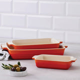 Le Creuset Rectangular Dish Volcanic Set of 3 on kitchen counter with olives bowl