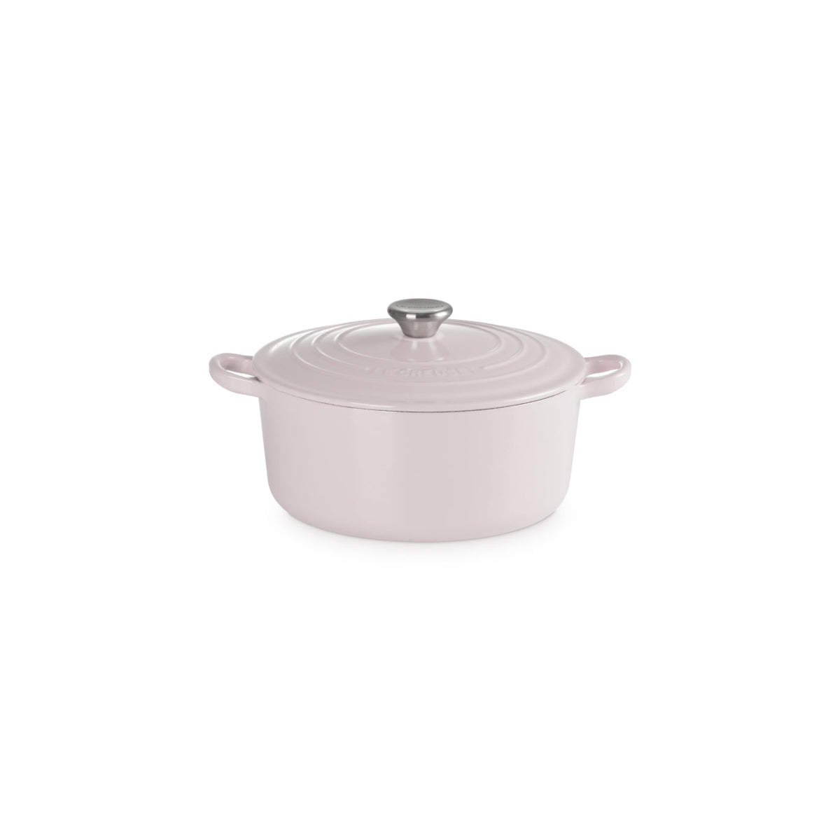 Angled view of Le Creuset Shallot round casserole with silver knob on white background.