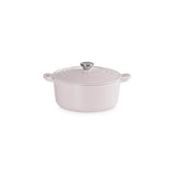 Angled view of Le Creuset Shallot round casserole with silver knob on white background.