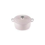 Angled view of Le Creuset Shallot round casserole with silver knob on white background.