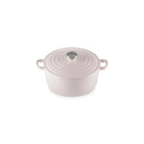 Angled view of Le Creuset Shallot round casserole with silver knob on white background.