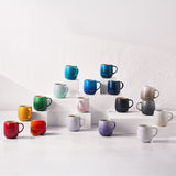 Le Creuset U Mug Coastal Blue among assorted Le Creuset mugs in various colors