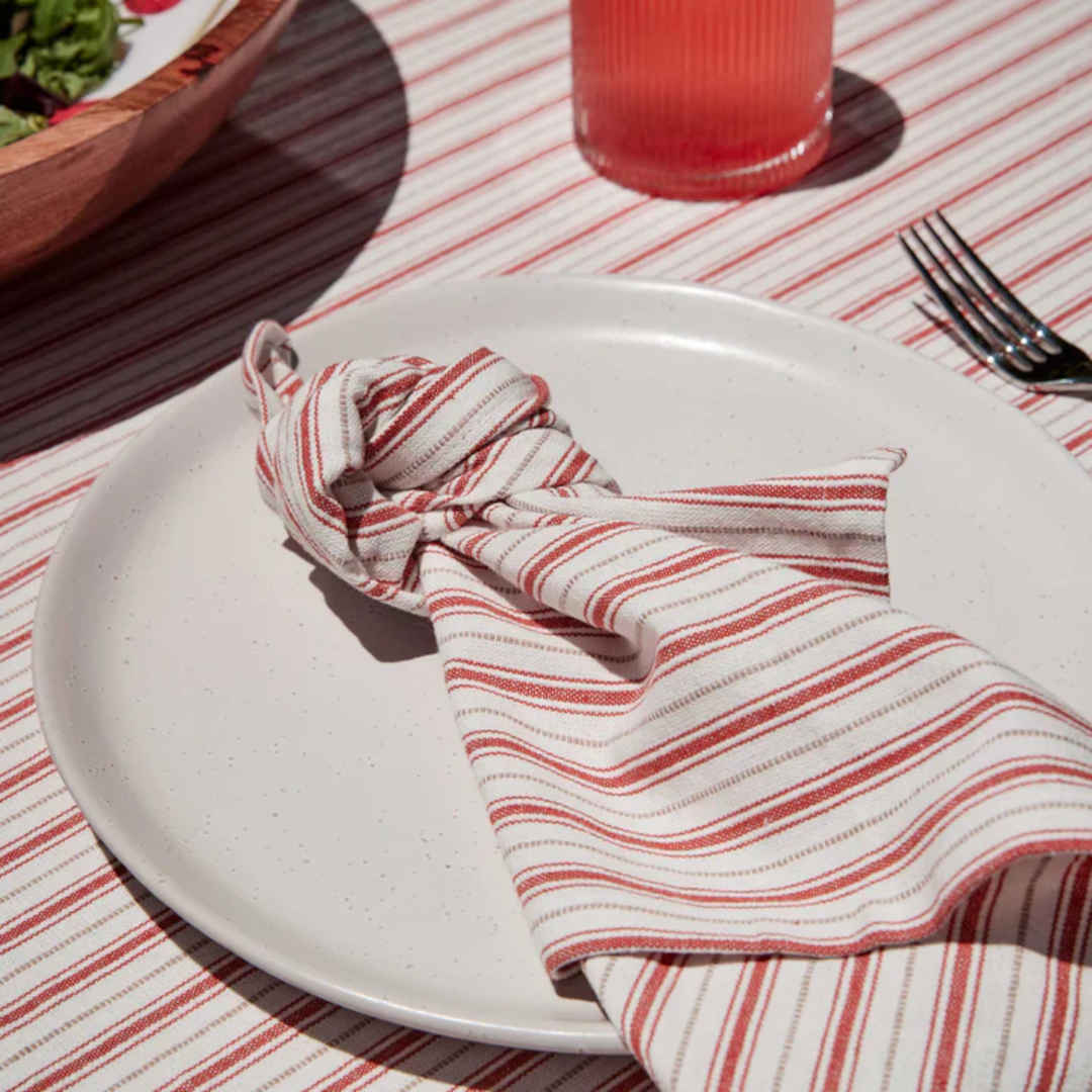 Madras Link Carol Red Stripe Tablecloth 150 x 230cm, top view of folded tablecloth with red stripe pattern