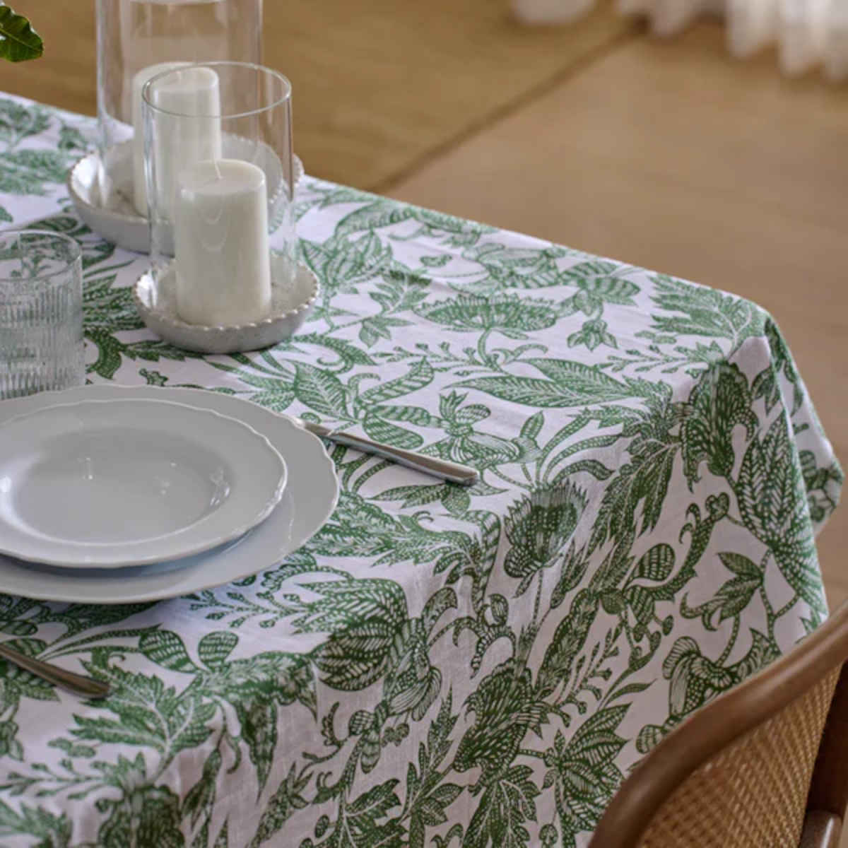 Madras Link Samara Tablecloth Green 150 x 230cm  – dining table styled with green leafy patterned tablecloth and tableware