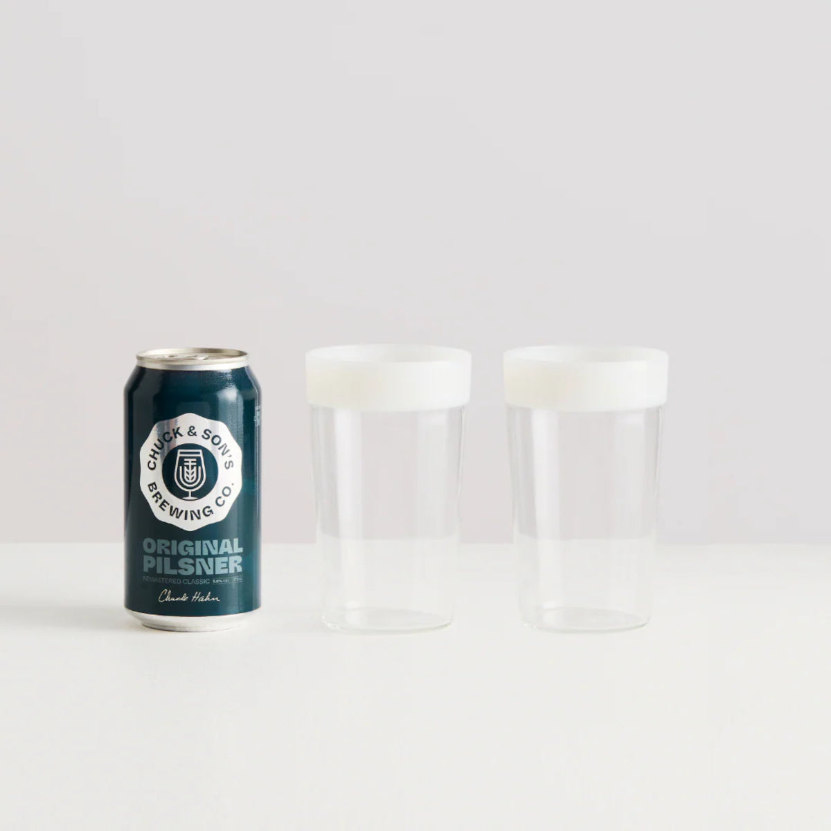 Maison Balzac Ceres Beer Glasses 375ml (Set of 2) – two glasses beside a beer can on white surface