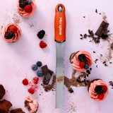 Microplane Premium Zester Sunset Orange, fine blade zester with bright orange handle and stainless steel grating surface