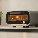 Ooni Volt 2 Pizza Oven Charcoal – kitchen view baking sesame bagels inside oven