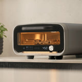 Ooni Volt 2 Pizza Oven Charcoal – kitchen view baking sesame bagels inside oven