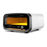 Ooni Volt 2 Pizza Oven Polar White – angled front view with digital display glowing