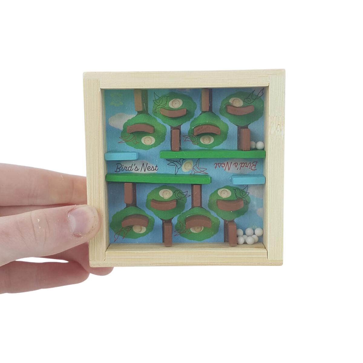 Project Genius Bird's Nest Puzzle - with a hand holding | Minimax
