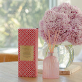 Peppermint Grove Pink Rose & Marshmallow reed diffuser 350ml with packaging, styled on table with pink flowers