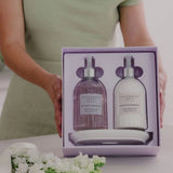 Beautifully presented gift set with hand wash, body cream, and ceramic tray in soft lilac tones