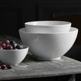 Pillivuyt Cecil Salad Bowl 20cm – lifestyle view with stacked bowls and grapes on a rustic wooden table