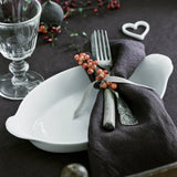 Pillivuyt Oval Eared Gratin 28 x 16cm – styled dining view with cutlery and napkin placed inside the classic white porcelain dish