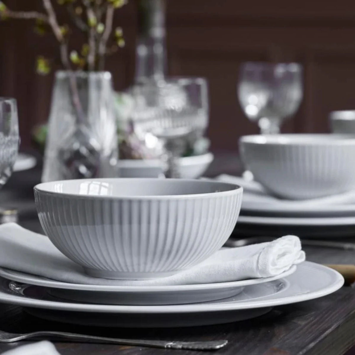 Pillivuyt Plissé Salad Bowl 15cm – styled on a dining table setting with matching dinnerware and glassware