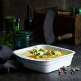 Pillivuyt Square Lasagne Dish 28cm x 26cm – lifestyle view with baked lasagne served in classic white porcelain dish