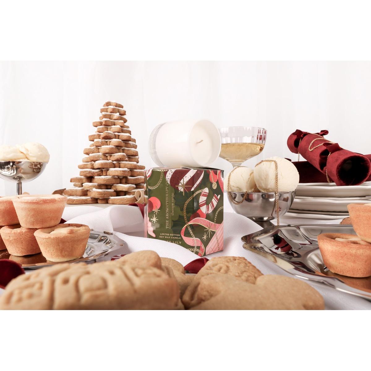 The Aromatherapy Co. White Lily & Holly Candle 80g – festive soy wax candle in white glass jar with seasonal green and red gift box