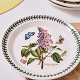 Portmeirion Botanic Garden Entrée Plate 20cm set featuring assorted floral patterns with butterflies and green leaf border, made from fine earthenware