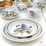 Portmeirion Botanic Garden Entrée Plate 20cm set featuring assorted floral patterns with butterflies and green leaf border, made from fine earthenware