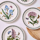 Portmeirion Botanic Garden Entrée Plate 20cm set featuring assorted floral patterns with butterflies and green leaf border, made from fine earthenware