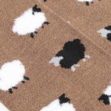 Pussyfoot sheep pattern socks taupe close-up, soft knit fabric with white and black sheep design detail