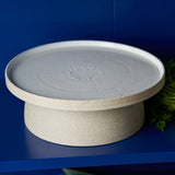 Royal Doulton Garden To Table Cake Stand White – styled view with subtle speckled finish on a deep blue background