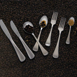 Tablekraft Elite Soup Spoon – part of Elite cutlery set with knives, forks, and spoons displayed on coffee beans