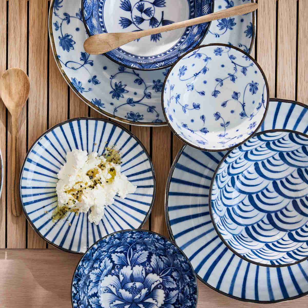Tokyo Design Natsu Nami Ramen Bowl Blue 21cm – styled table setting with assorted blue patterned bowls and plates