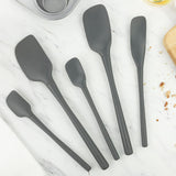 Tovolo 5 piece charcoal silicone spatula set displayed on marble countertop