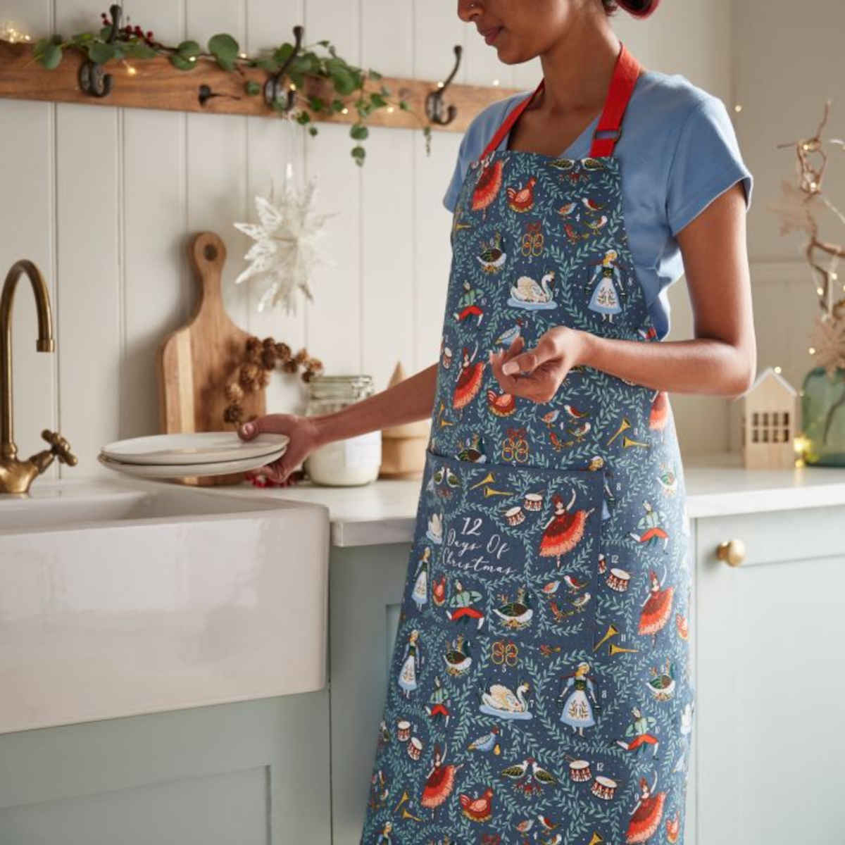 Ulster Weavers 12 Days of Christmas Apron – front view on mannequin