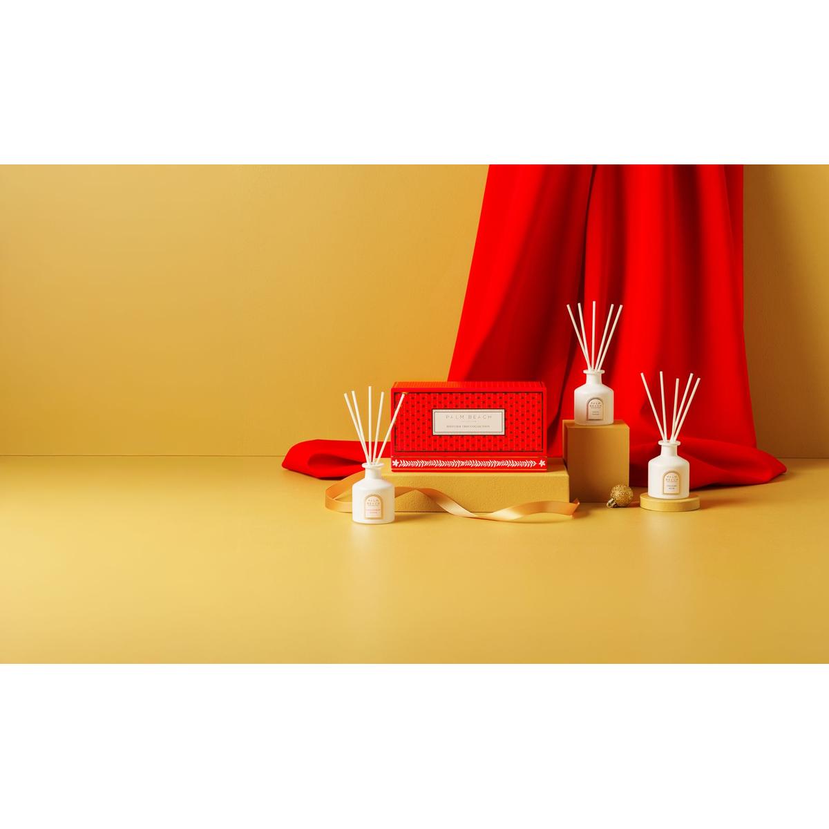 Palm Beach Collection Mini Diffuser Trio Gift Set – three 50ml fragrance diffusers in festive red box, perfect holiday gift.