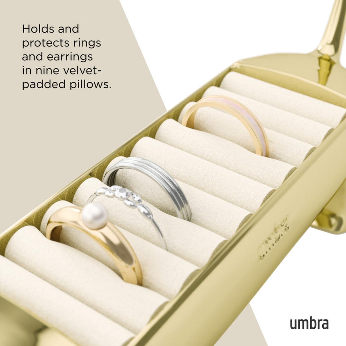 Umbra Dachsie Ring Holder Brass shaped like a dachshund with ridged tray along its back