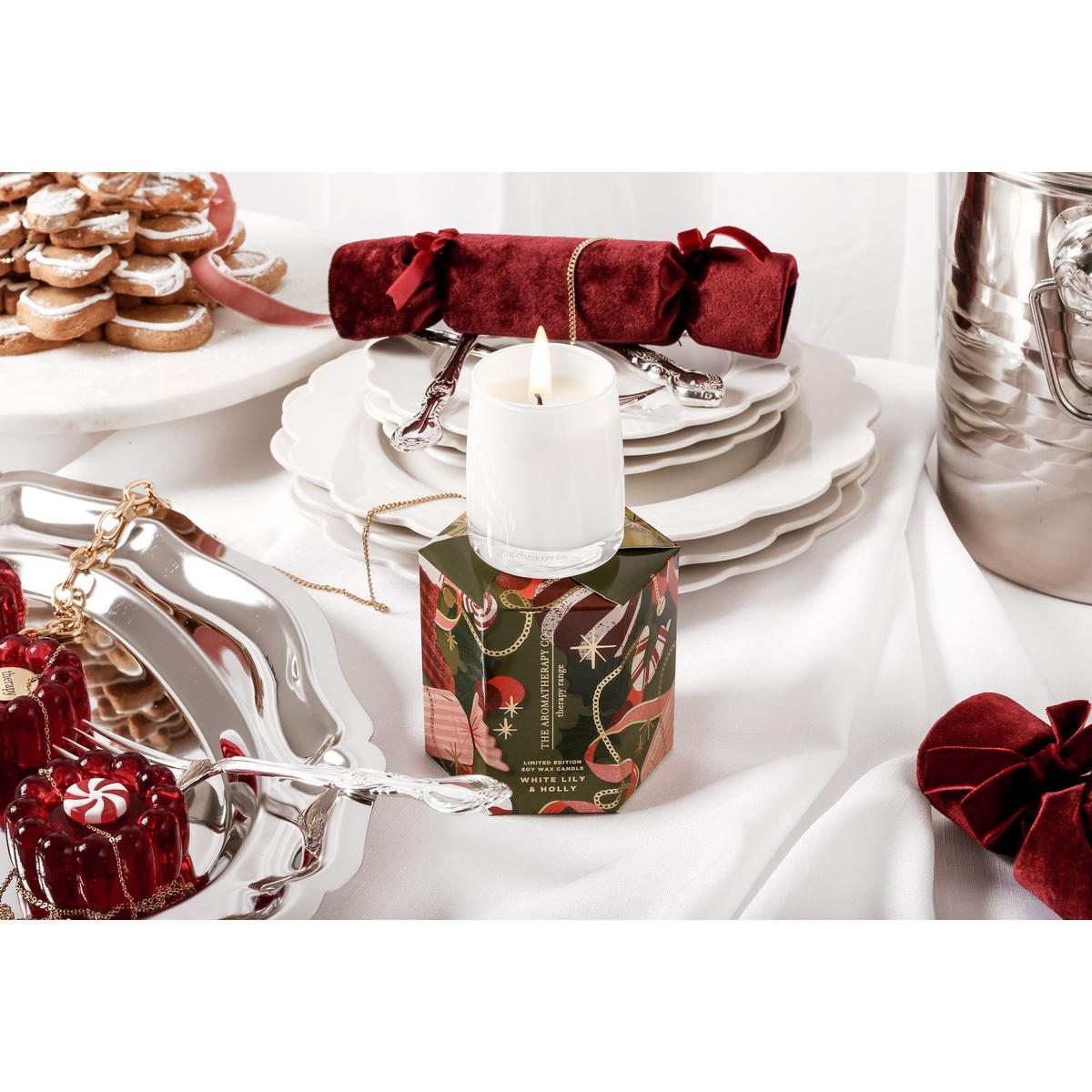 The Aromatherapy Co. White Lily & Holly Candle 80g – festive soy wax candle in white glass jar with seasonal green and red gift box