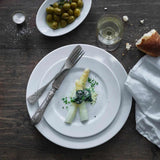 Pillivuyt Sancerre Dinner Plate 31cm– White Sancerre plates on table with food and wine